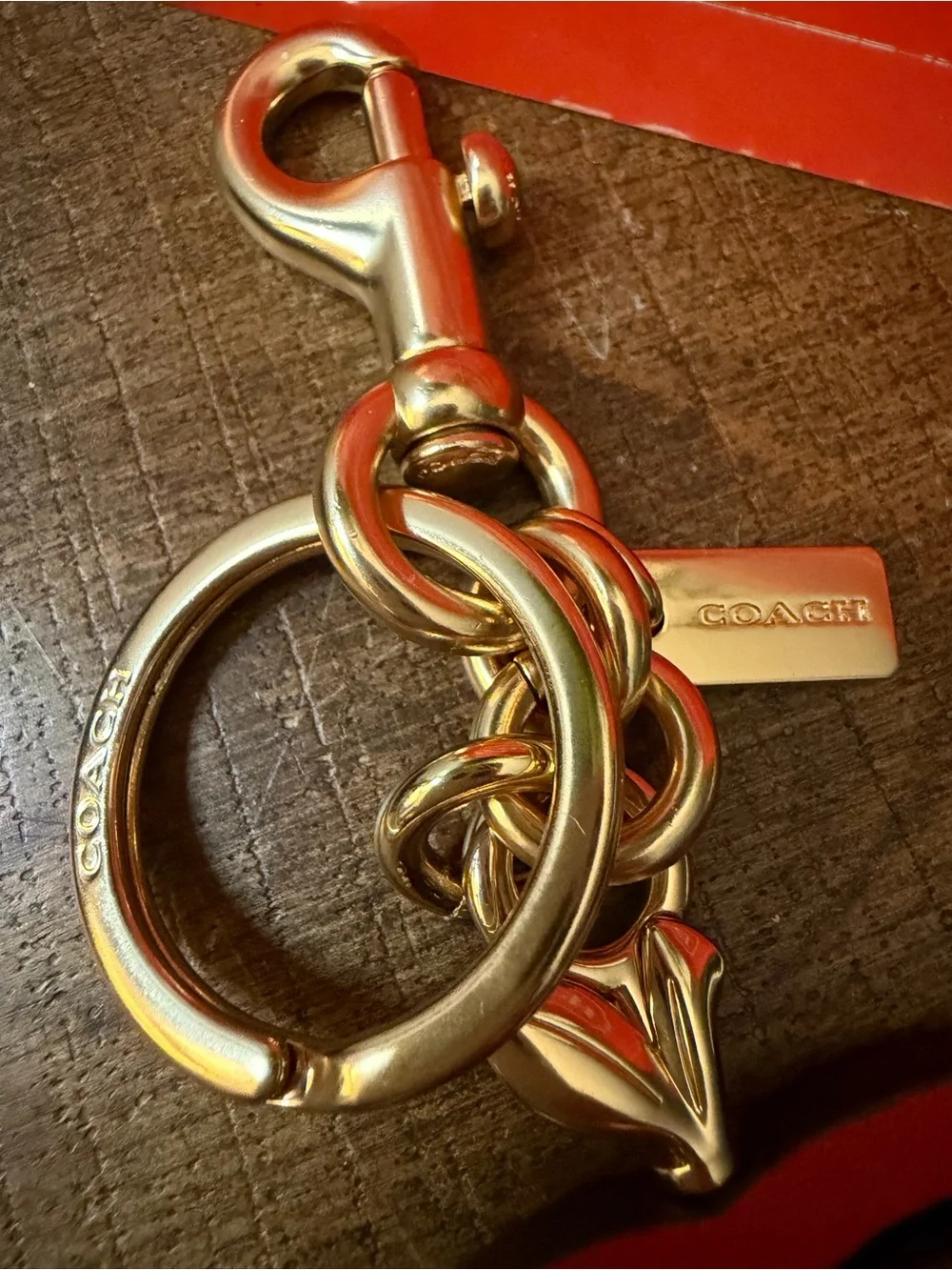 Coach Swivel Apple Charm